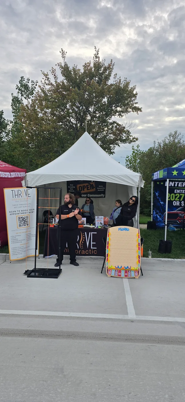 The Thrive Chiropractic booth at a Troy community event